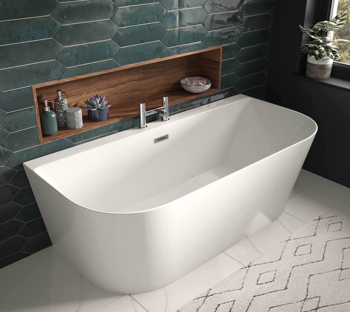 <h4>Finding Your Perfect Fit: Tips for Choosing a Bath</h4><br>
<p>Now that you're inspired by the latest trends, let's get down to the practicalities of picking the perfect bath for your bathroom:</p>
<p><b>Size Matters: </b> Be realistic about the space you have. Freestanding baths are luxurious, but they need a bit of room to shine. Alternatively, back to wall <a class="p-0"href="/product/wsdsh18-bayou-d-shape-1800-x-800-x-580mm-277-litre-capacity-white"><b>Bayou D Shape baths</a></b> give the wow factor of a freestanding bath, are a great space-saving option and available in a variety of sizes to suit your space. If space is at a real premium, go for a curved <a class="p-0"href="/product/jba1650lh-bayou-j-bath-double-ended-bath-1650-x-725mm-white-lh"><b>Bayou J bath</a></b>  or a <a class="p-0"href="/product/iba1775-bayou-i-bath-single-ended-shower-bath-1700-x-750mm-white"><b>Bayou I bath</a></b> with space for a shower overhead will create a modern look.<br></p>
<p><b>Feature taps:</b> For long luxurious soaks, and space allows opt for a freestanding tap. Alternatively, wall mounted taps give a more on trend look, just remember you want the water to fall nicely inside the bath whilst ensuring you have just enough space to clean behind the bath. If you have young children, a showerhead with a detachable spray or bath taps with a shower mixer is a lifesaver for rinsing them off! </p>
<p><b>Materials:</b>   Each material has its own benefits:<br>
<b>Cast Iron:</b> Durable and retains heat for long soaks.<br>
<b>Acrylic:</b> Lightweight, affordable, and comes in a wide variety of styles.<br>
<b>Stone:</b> Luxurious and elegant, but can be expensive and require special care (we have personal experience of owning one!).</p><br>