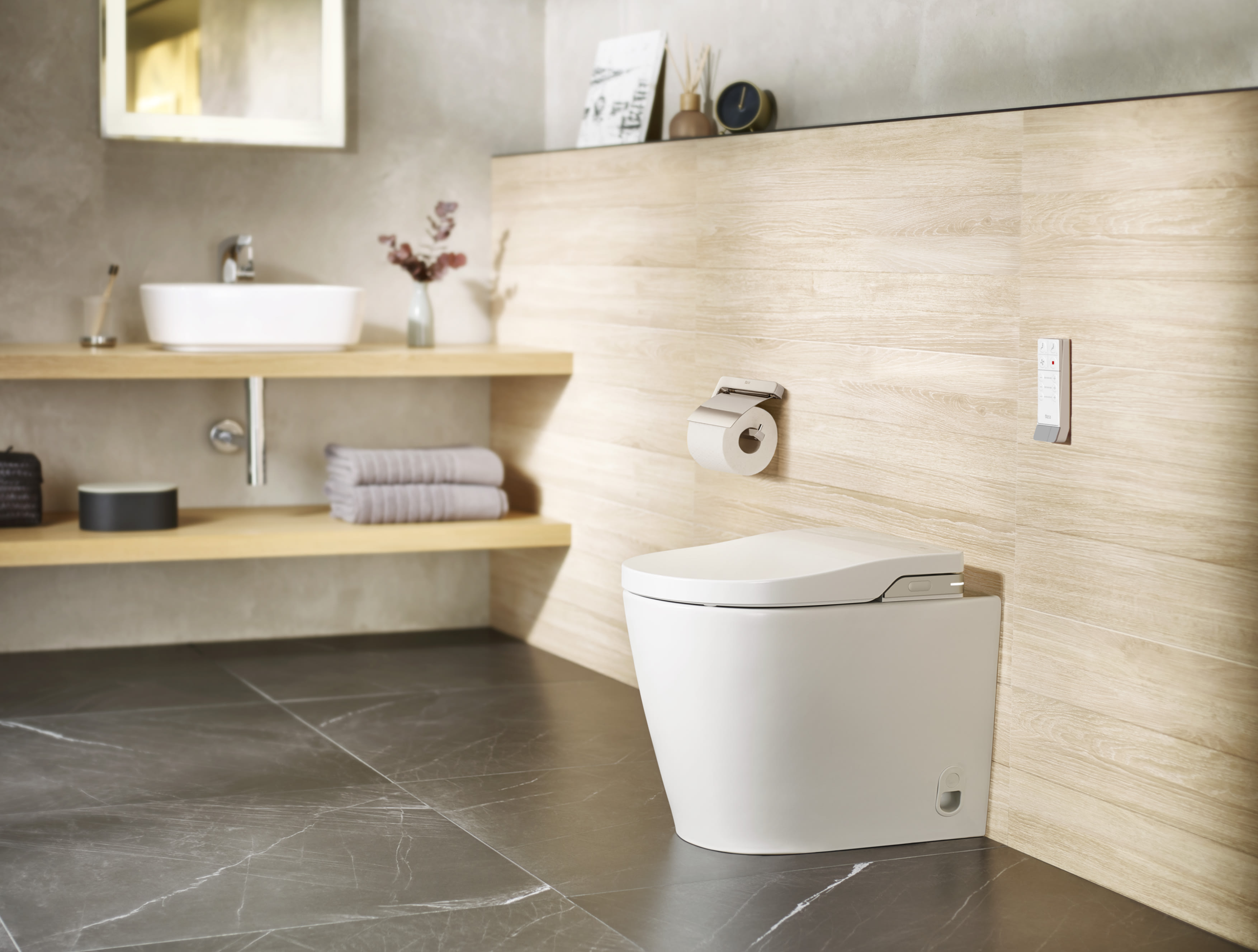 <h3>Thinking of upgrading your bathroom with a smart toilet? Let's explore Vitra and Roca!</h3></p><b>
Looking to upgrade your bathroom with a touch of luxury and improved hygiene? Both Vitra and Roca are popular brands offering high-tech smart toilets, but choosing the right one can feel overwhelming. Don't worry, we're here to help! This review dives into the features, benefits, and installation tips for each brand to help you make an informed decision.</b></p>
<i>(Picture above: Roca InWash close up; Picture below: Roca In Wash Smart Toilet in /neutral bathroom)</i>